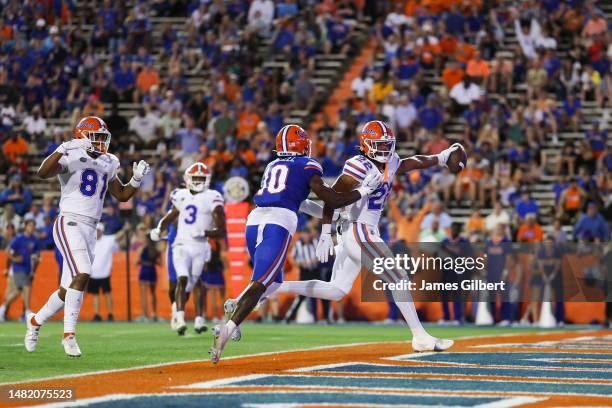 Kahleil Jackson scores a touchdown against Miguel Mitchell during the 2nd quarter of the Florida Gators spring football game at Ben Hill Griffin...