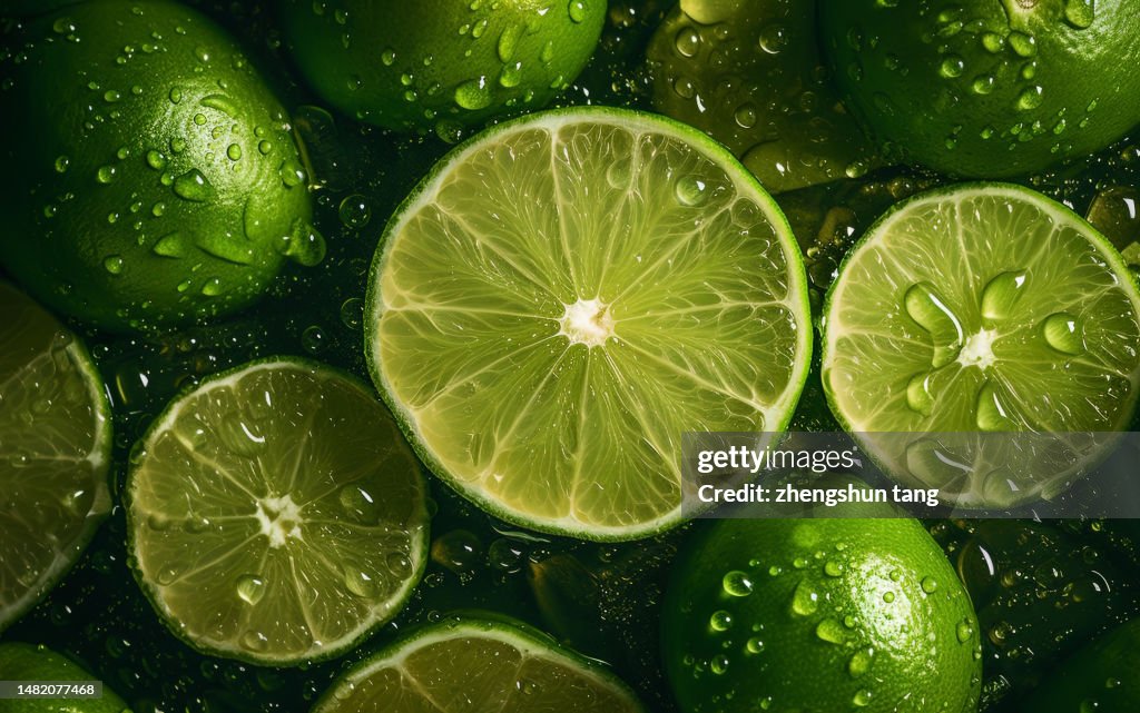 Sliced limes showered with water