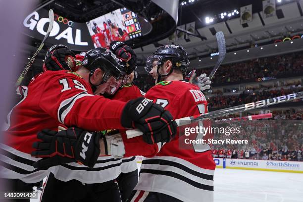 Jonathan Toews of the Chicago Blackhawks is congratulated by teammates following a goal against the Philadelphia Flyers during the second period at...