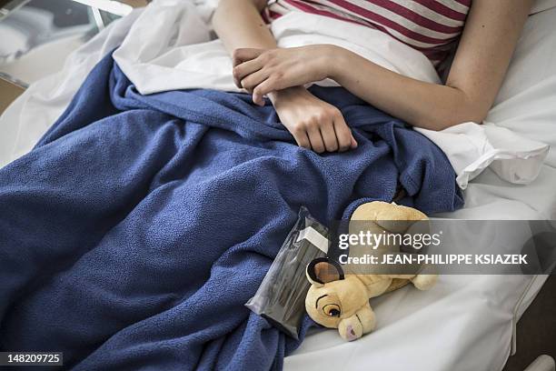 Patient is pictured in her room in a special treatment unit for teenagers from 15 to 25 years old living with cancer, at the "Institut d'hematologie...