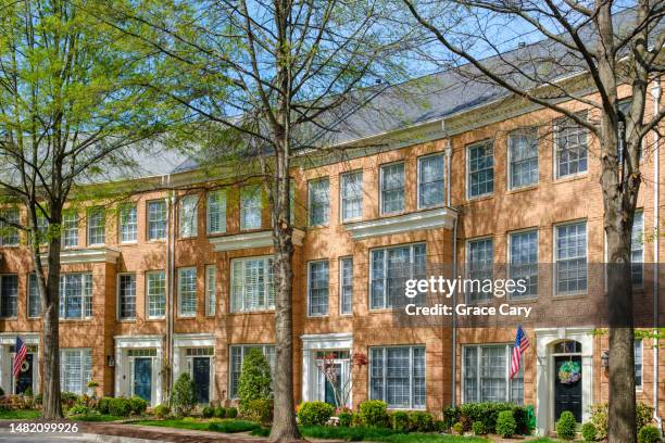 row of brick townhouses in residential district - alexandria va stock pictures, royalty-free photos & images