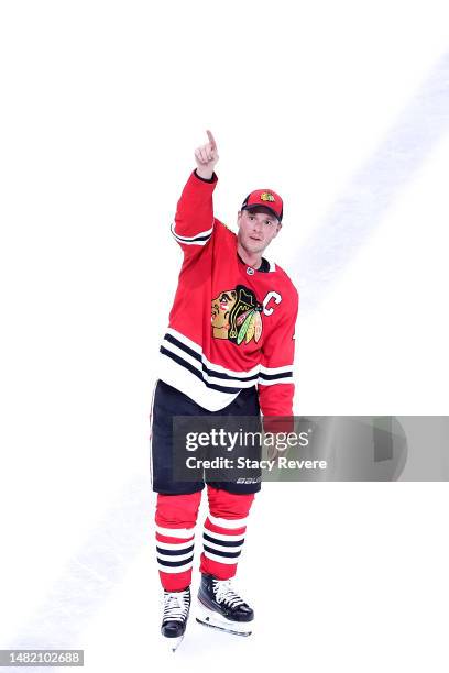 Jonathan Toews of the Chicago Blackhawks waves to the crowd following a game against the Philadelphia Flyers at United Center on April 13, 2023 in...