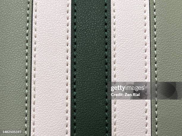 front details of a two-toned green handbag - cucitura foto e immagini stock