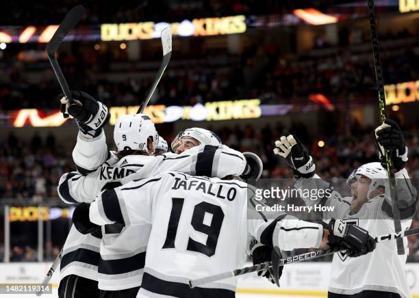 Adrian Kempe of the Los Angeles Kings celebrates his power play goal with Drew Doughty, Alex Iafallo and Viktor Arvidsson, to take a 4-1 lead, during...