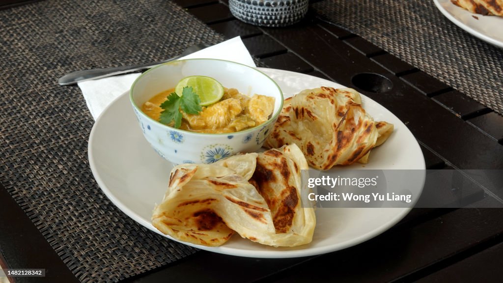 Roti Canai , Prata with chicken curry
