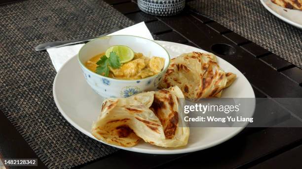 roti canai , prata with chicken curry - traditional malay food stock pictures, royalty-free photos & images