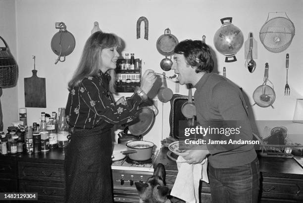 French actress Marina Vlady is serenaded by her husband Vladimir Vysotsky, a Russian anti-establishment actor, poet, songwriter and singer in the...