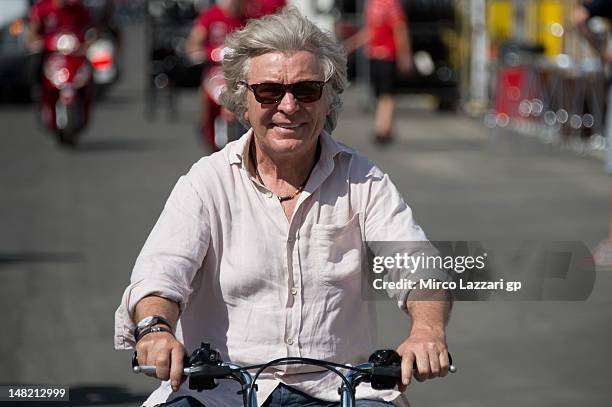 Angel Nieto of Spain rides the scooter in paddock during the MotoGp of Italy at Mugello Circuit on July 12, 2012 in Scarperia, Italy.