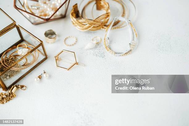 pearl and golden jewelry on white surface and in boxes. - bijou - fotografias e filmes do acervo