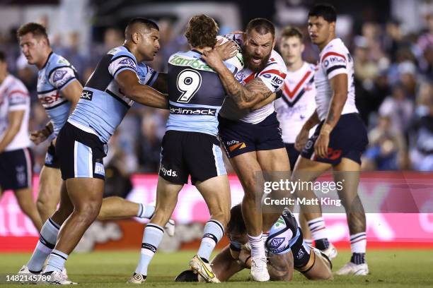 Jared Waerea-Hargreaves of the Roosters is tackled during the round seven NRL match between the Cronulla Sharks and Sydney Roosters at PointsBet...