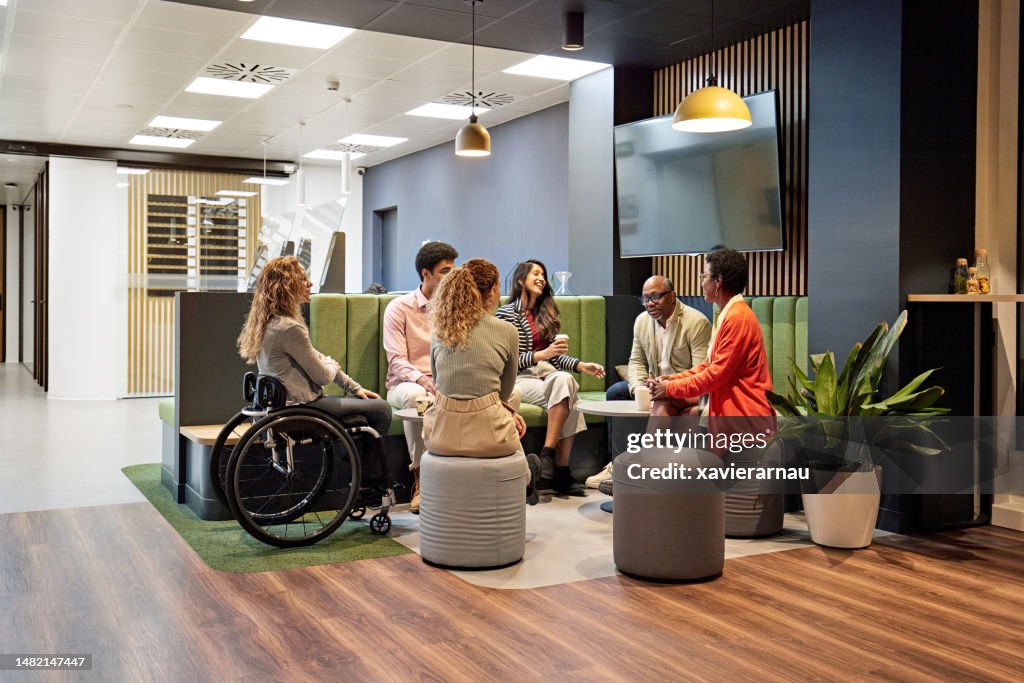 Business team meeting in modern office sitting area