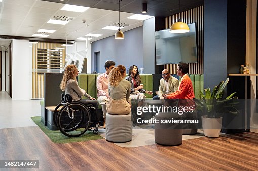 Business team meeting in modern office sitting area Business team meeting in modern office sitting area