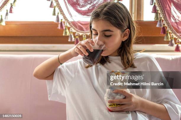 beautiful girl tasting raw meatballs - turkey meat balls stock pictures, royalty-free photos & images