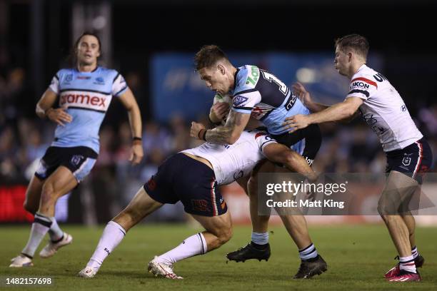 Cameron McInnes of the Sharks is tackled during the round seven NRL match between the Cronulla Sharks and Sydney Roosters at PointsBet Stadium on...