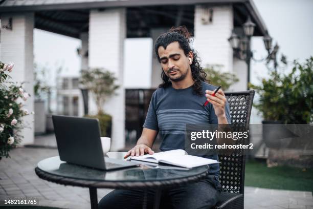 working from home on a rooftop balcony - modern vietnam stock pictures, royalty-free photos & images