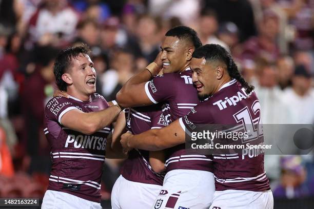 Tom Trbojevic of the Sea Eagles celebrates with team mates after scoring a try during the round seven NRL match between the Manly Sea Eagles and...