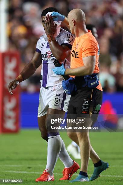 Tui Kamikamica of the Storm is assisted off the field for a HIA during the round seven NRL match between the Manly Sea Eagles and Melbourne Storm at...