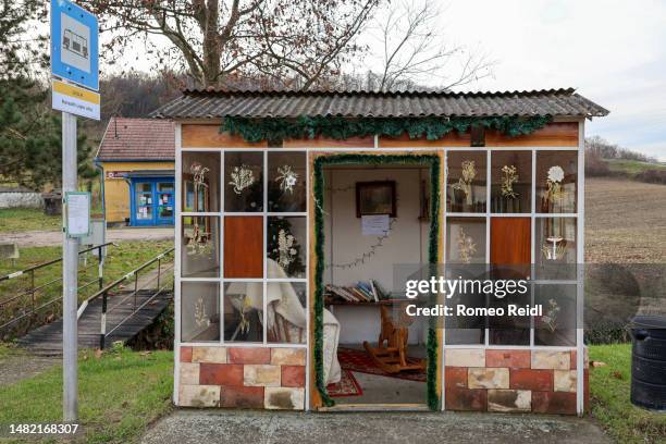 front view of a christmas decorated bus stop in lulla, hungary - bus hungary stock pictures, royalty-free photos & images