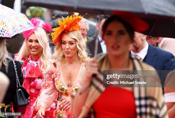 Race goers are pictured on Ladies Day during the second day of the Grand National Festival at Aintree Racecourse on April 14, 2023 in Liverpool,...