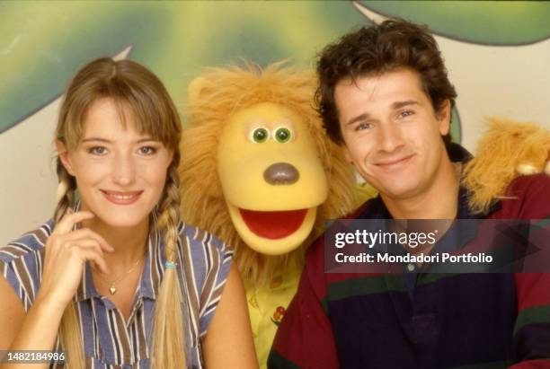 Italian tv hosts Marco Bellavia and Deborah Magnaghi in Bim bum Bam television studio together with puppet Ambrogio. Italy, 1996