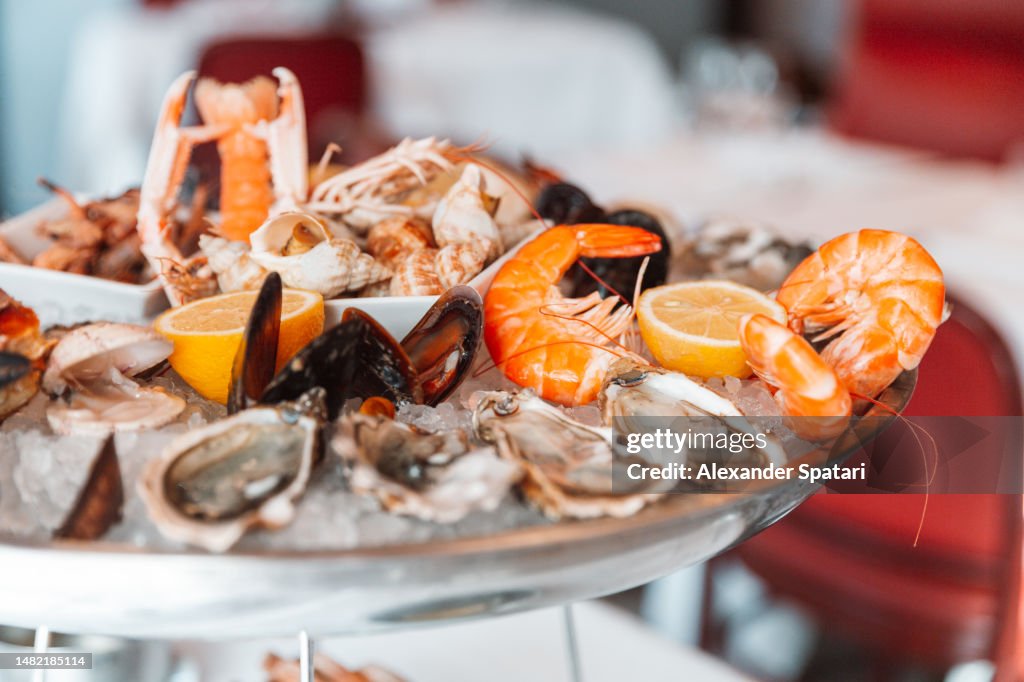 Close-up of a seafood platter with oysters and shrimps in a luxury restaurant