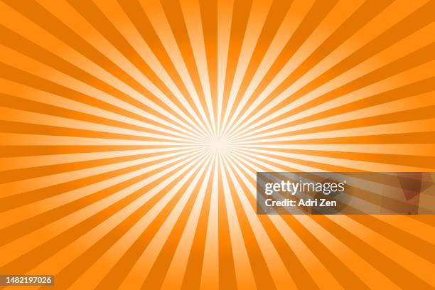 an orange sunburst background - oranger hintergrund stock-fotos und bilder