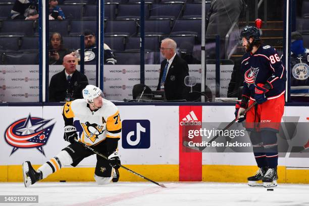 Evgeni Malkin of the Pittsburgh Penguins and Kirill Marchenko of the Columbus Blue Jackets talk during pregame warmups prior to a game at Nationwide...