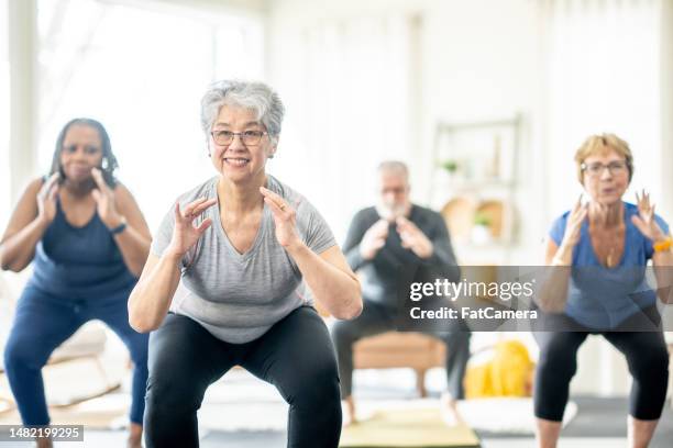 seniors fitness - senior yoga stock pictures, royalty-free photos & images