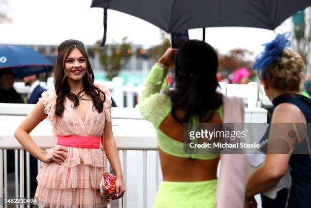 Race goers are pictured on Ladies Day during the second day of the Grand National Festival at Aintree Racecourse on April 14, 2023 in Liverpool,...