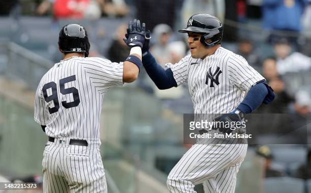 Jose Trevino and Oswaldo Cabrera of the New York Yankees in action against the Philadelphia Phillies at Yankee Stadium on April 05, 2023 in Bronx,...