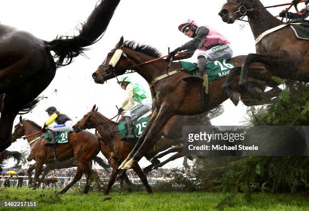 Coopers Cross ridden Ryan Mania jump the Chair in the Randox Supports Race Against Dementia Topham Handicap Chase on Ladies Day during the second day...
