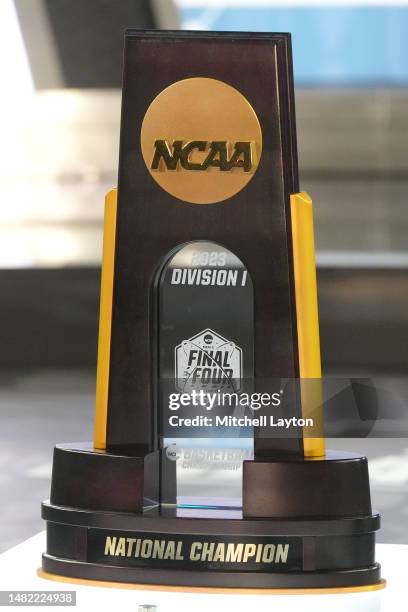 The NCAA Mens basketball trophy on the floor before the NCAA Men's Basketball Tournament Final Four championship game between the Connecticut Huskies...