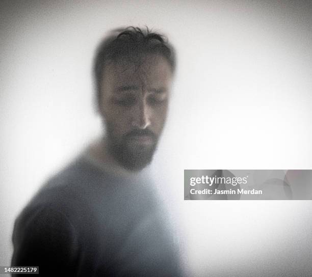 man in despair, depression - head in hands silhouette stock pictures, royalty-free photos & images