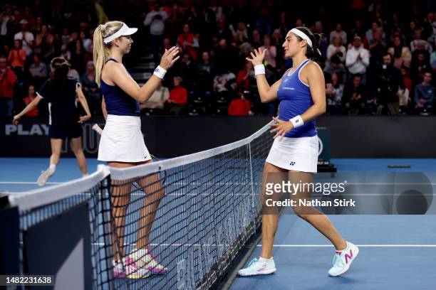 Caroline Garcia of France shakes hands after winning her match with Katie Boulter of Great Britain the during the Billie Jean King Cup Qualifier...