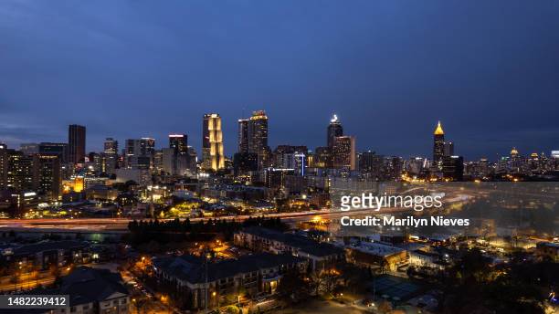 wide drone point of view of downtown atlanta at night - "marilyn nieves" stock pictures, royalty-free photos & images