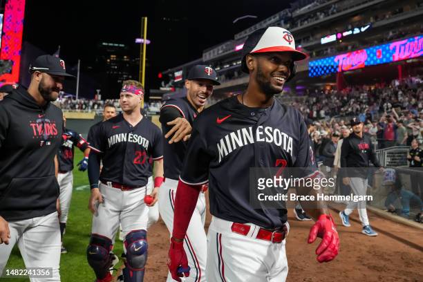 Michael A. Taylor of the Minnesota Twins celebrates with teammates against the Chicago White Sox on April 11, 2023 at Target Field in Minneapolis,...