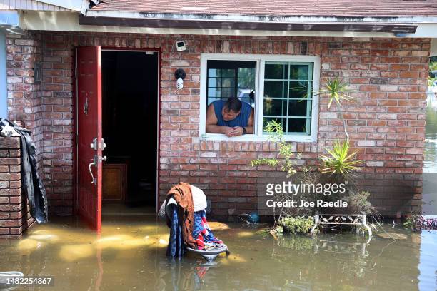 John Forman looks out at the flood waters surrounding the home he has lived in for nine years on April 14, 2023 in Fort Lauderdale, Florida. Nearly...