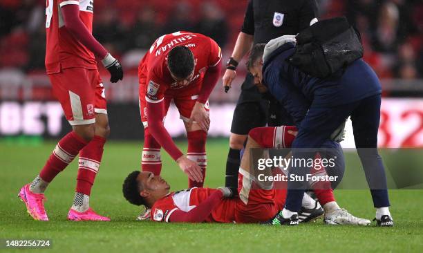 Middlesbrough player Aaron Ramsey receives treatment for an injury before leaving the field with an injury during the Sky Bet Championship between...