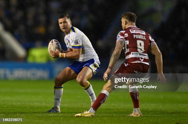 Josh Drinkwater of Warrington looks to get past Sam Powell of Wigan during the Betfred Super League between Warrington Wolves and Wigan Warriors at...