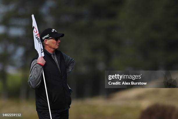 Mike Dean, caddie of Whitney Hillier of Australia and former football referee looks on from the eighteenth green during The Rose Ladies Series at...