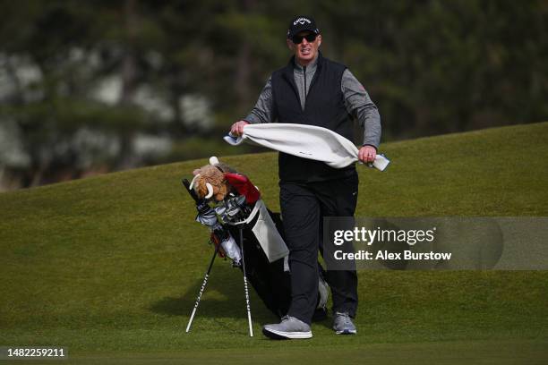 Mike Dean, caddie of Whitney Hillier of Australia and former football referee looks on from the eighteenth green during The Rose Ladies Series at...