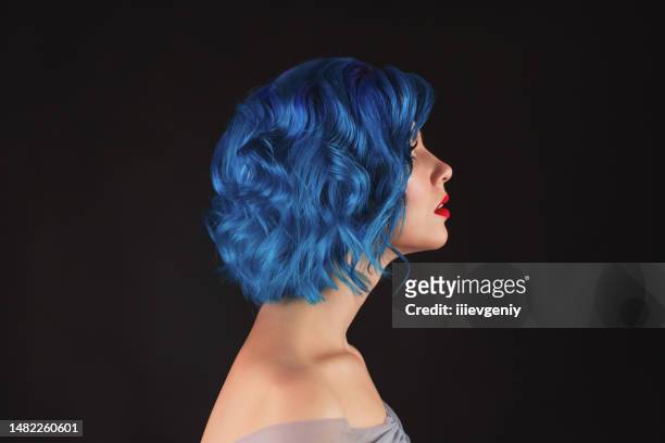 girl with blue dyed hair in studio on black background - gothic style imagens e fotografias de stock