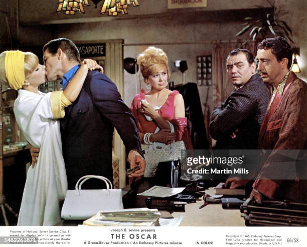 In this Embassy Pictures Corp. Handout German actress Elke Sommer and Northern Irish actor Stephen Boyd kiss as American actors Edie Adams , Ernest...
