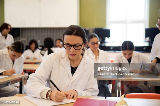 girls in stem, female college students in science classroom. - school science project stock pictures, royalty-free photos & images