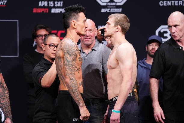 Max Holloway and Arnold Allen of England face off during the UFC Fight Night ceremonial weigh-in at T-Mobile Center on April 14, 2023 in Kansas City,...