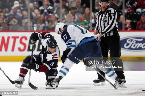 Andrew Cogliano of the Colorado Avalanche faces off against Adam Lowry of the Winnipeg Jets at Ball Arena on April 13, 2023 in Denver, Colorado.