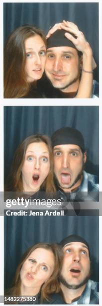 vintage couple wearing 1990s fashion in photobooth, 2000s couple photo booth portrait, young couple having fun - photo booth couple stock pictures, royalty-free photos & images