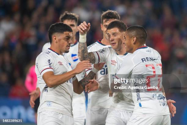 Ignacio Ramirez of Nacional celebrates with teammates the team's second goal during a match between Nacional and Fenix as part of Campeonato Apertura...