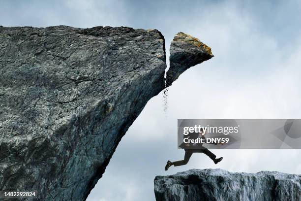 man runs from impending disaster - impending stock pictures, royalty-free photos & images