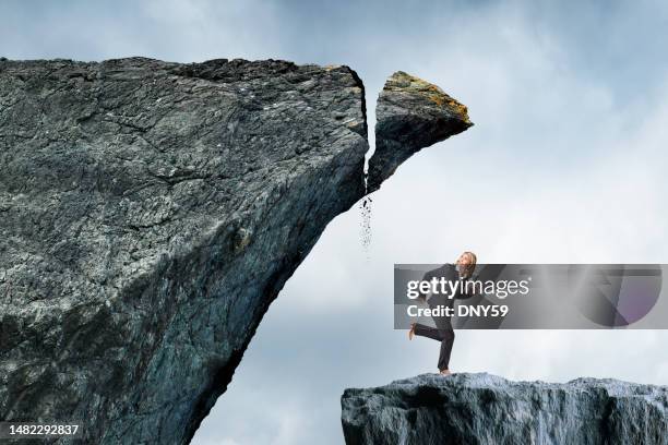 woman runs from impending disaster - impending danger stock pictures, royalty-free photos & images